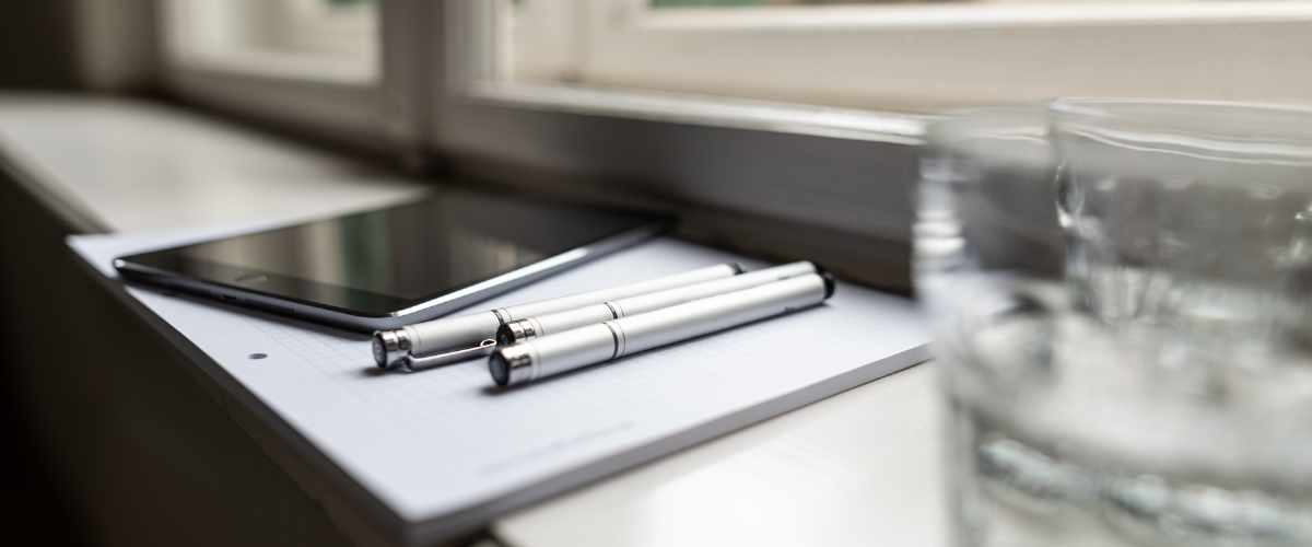 An iPad lying on the windowsill